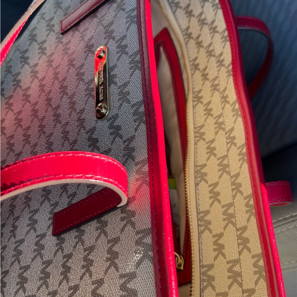 Michael Kors tote 19 length 11 wide zippered closures outside and out. 3 inside - Picture 5 of 11